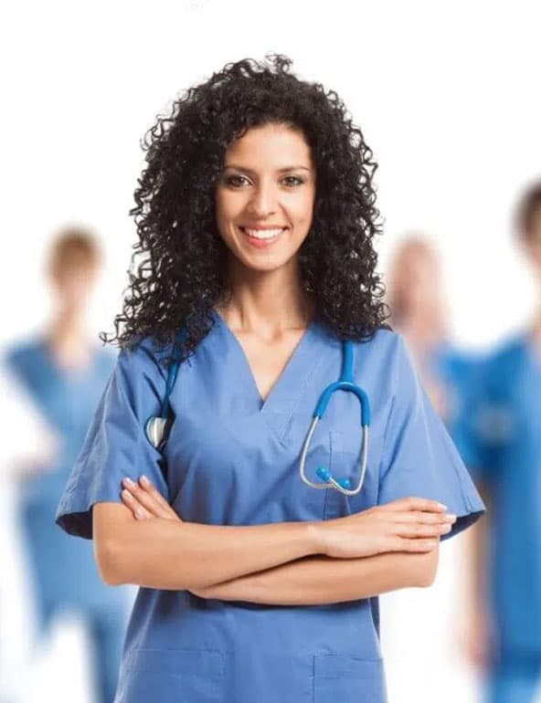 Smiling nurse in blue scrubs with a stethoscope